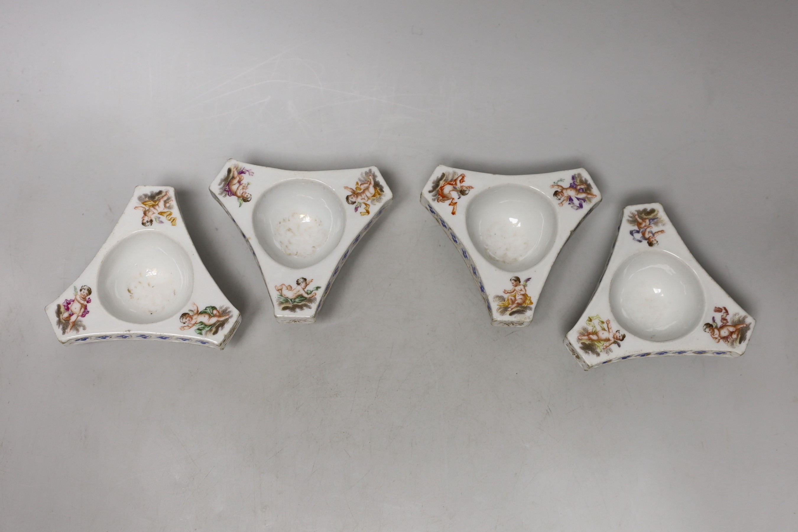 A set of four Dresden triangular cherub salts, Helena Wolfsohn atelier, 8cms wide